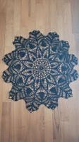 Handmade black crochet doily, elegant table decoration.