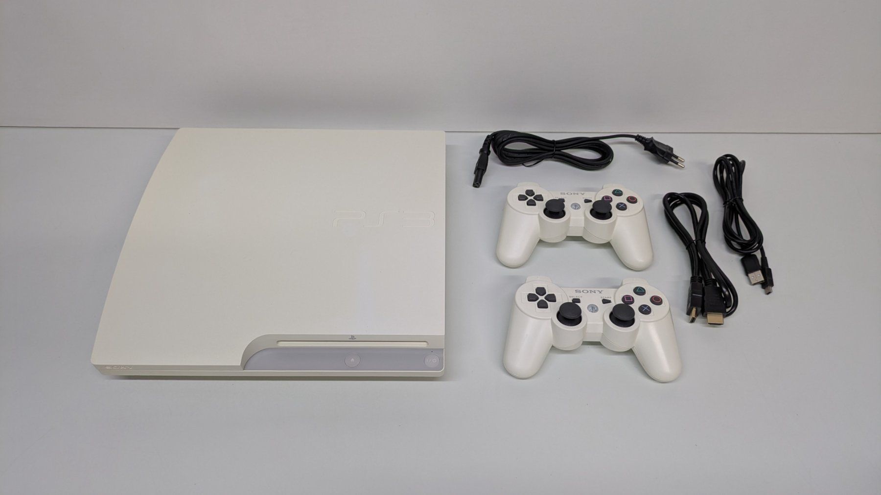 Sony Console: PlayStation 3 Slim in weiss mit 2 Controller – Usato da Menziken venduto da mame18