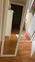 Full-body mirror with white frame