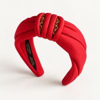 Serre-tête Alexandre de Paris rouge avec chaîne or