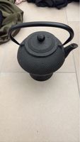 Cast iron teapot black round textured handle
