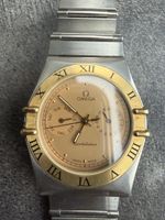 Montre Omega Constellation acier or cadran doré 