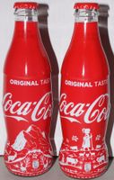 2 exklusive Coca-Cola Flaschen mit speziellen Motiven