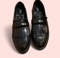 Black leather loafers
