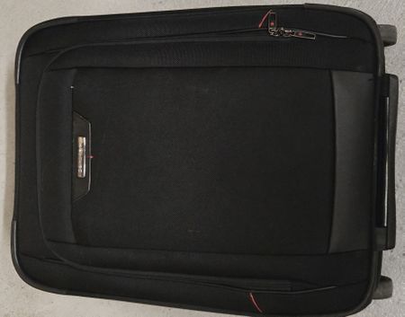 Schwarzer Samsonite Rollkoffer Perfekt für die Sommerferie