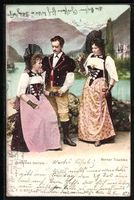 Zwei Frauen und Mann in Berner Trachten