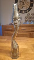 Coca Cola Flasche mit Goldigem Sand gefüllt