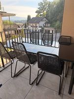 Glastisch und 6 Stühle