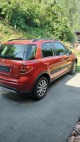 Suzuki SX4 4x4 orange occasion bon état