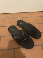 Black mesh sandals with flower detail 