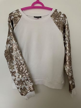 Sweat col rond avec manches à paillettes