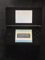 Console portable Nintendo DS Lite noir avec étui fourni