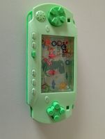 Wasser-Geschicklichkeitsspiel Dinosaurier grün (Retro-Spiel)