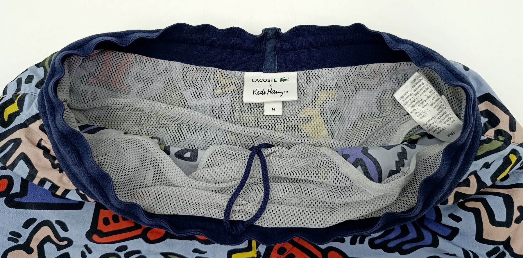 Lacoste Hosen: Lacoste x Keith Haring Badehose, Grösse M – Gebraucht aus Wil SG von Donaldus 3