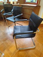 3 Freischwinger Stühle schwarz mit Armlehnen