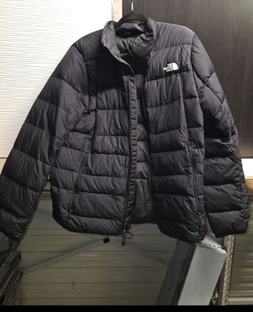 Veste The North Face noire avec défaut