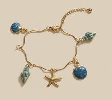Ocean-Themed Charm Bracelet: Seashells and Starfish Style