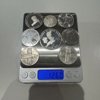 Collection of 8 different silver coins, 126 g