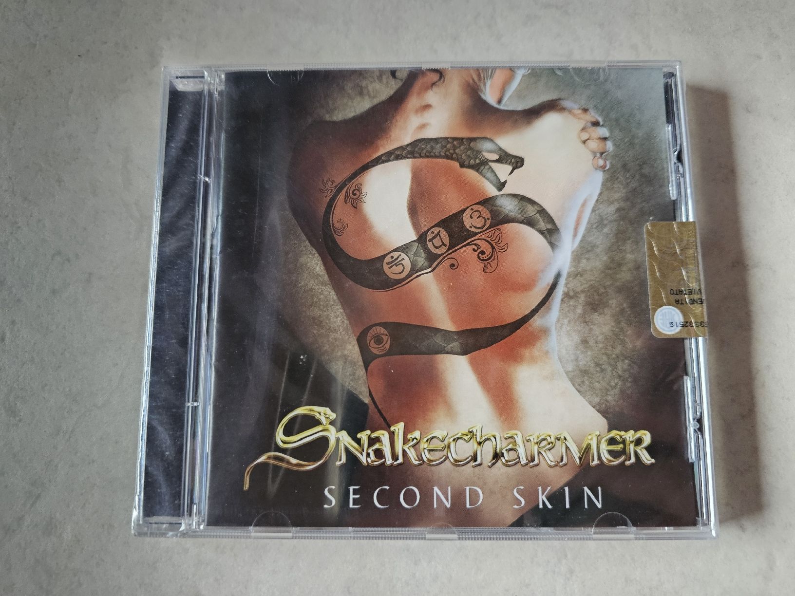 CDs: Snakecharmer  -  Second Skin  /  Fabrikneu – Neu und originalverpackt aus Schneisingen von backstore24