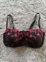 Black bra with red floral embroidery, size 80C. 