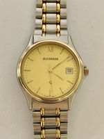 Montre Bucherer quartz bicolore etat comme neuf