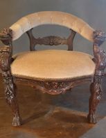 Antique English Victorian-style carved oak armchair