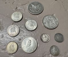 Diverse Silbermünzen darunter ein Morgan Dollar 1889