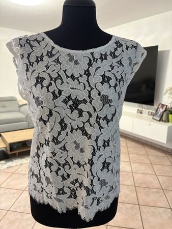 Maglietta da donna in pizzo bianco motivo floreale