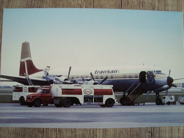 Cartoline postali: Transair DC-7 CF-TAY – Nuovo e nell'imballaggio originale da Thun venduto da Abigboss