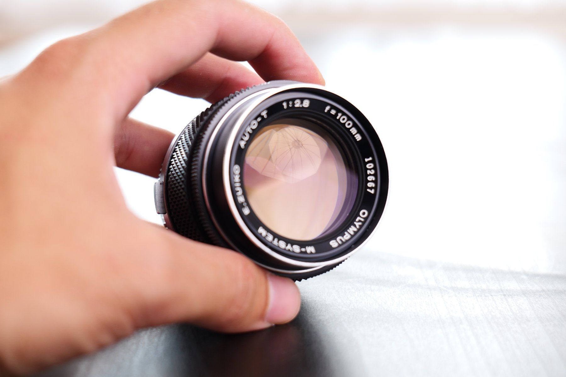 Olympus Objectifs: Olympus OM Zuiko 100mm f2.8 – D'occasion à Tecknau par LevinLaufmann