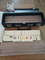Rummikub Spiel mit 106 Steinen und Koffer completo