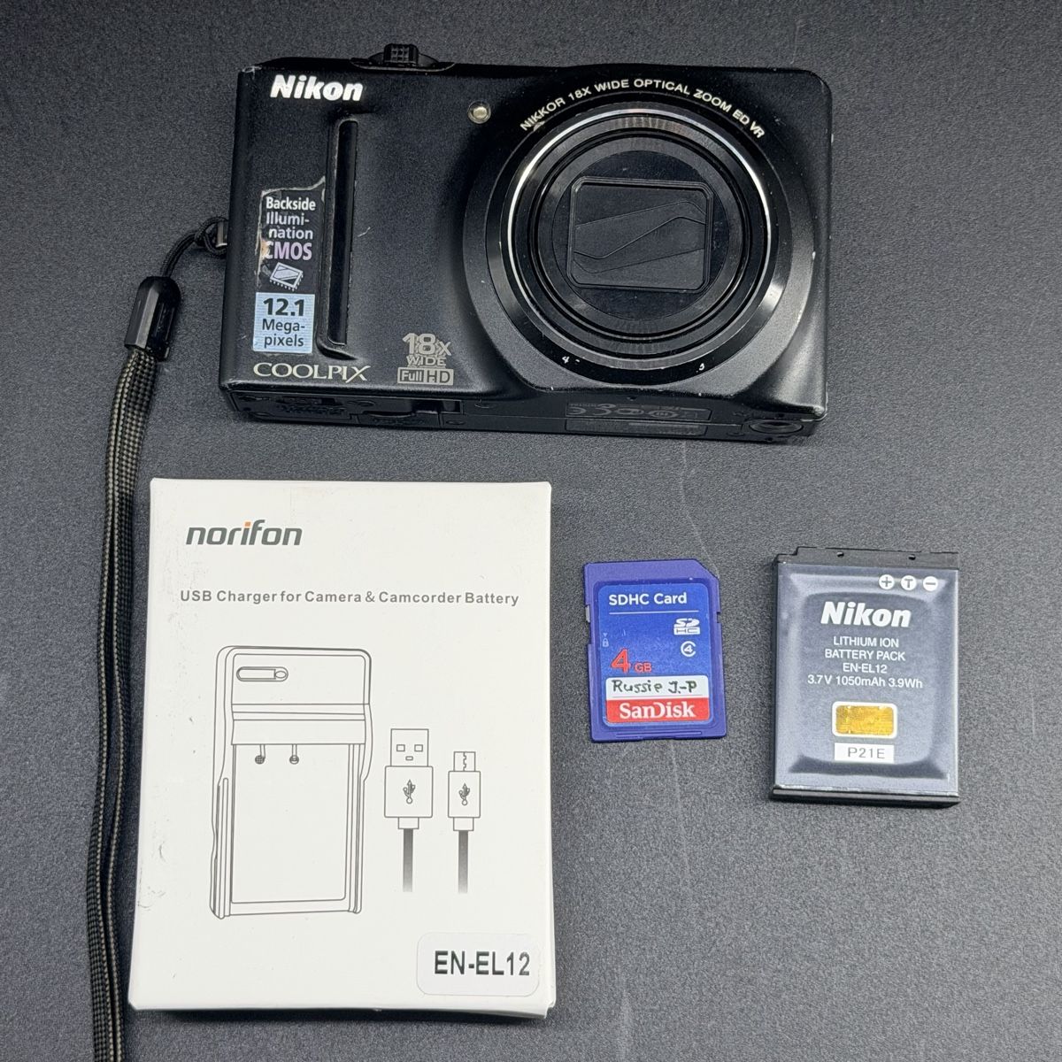 Nikon Kamera: Nikon Coolpix S9100 testée + batterie + chargeur + SD – Gebraucht aus Vessy von _Callidus_