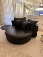 Rundes Sofa schwarz Leder mit Kissen