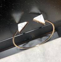 Bracelet doré triangles marbre blanc