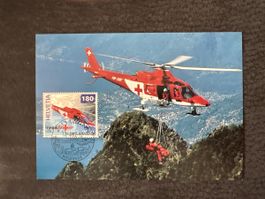 Carte postale hélicoptère de secours suisse et timbre