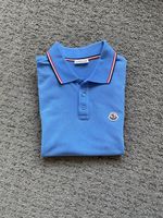 Polo Moncler bleu ciel en coton - Taille S, État neuf!