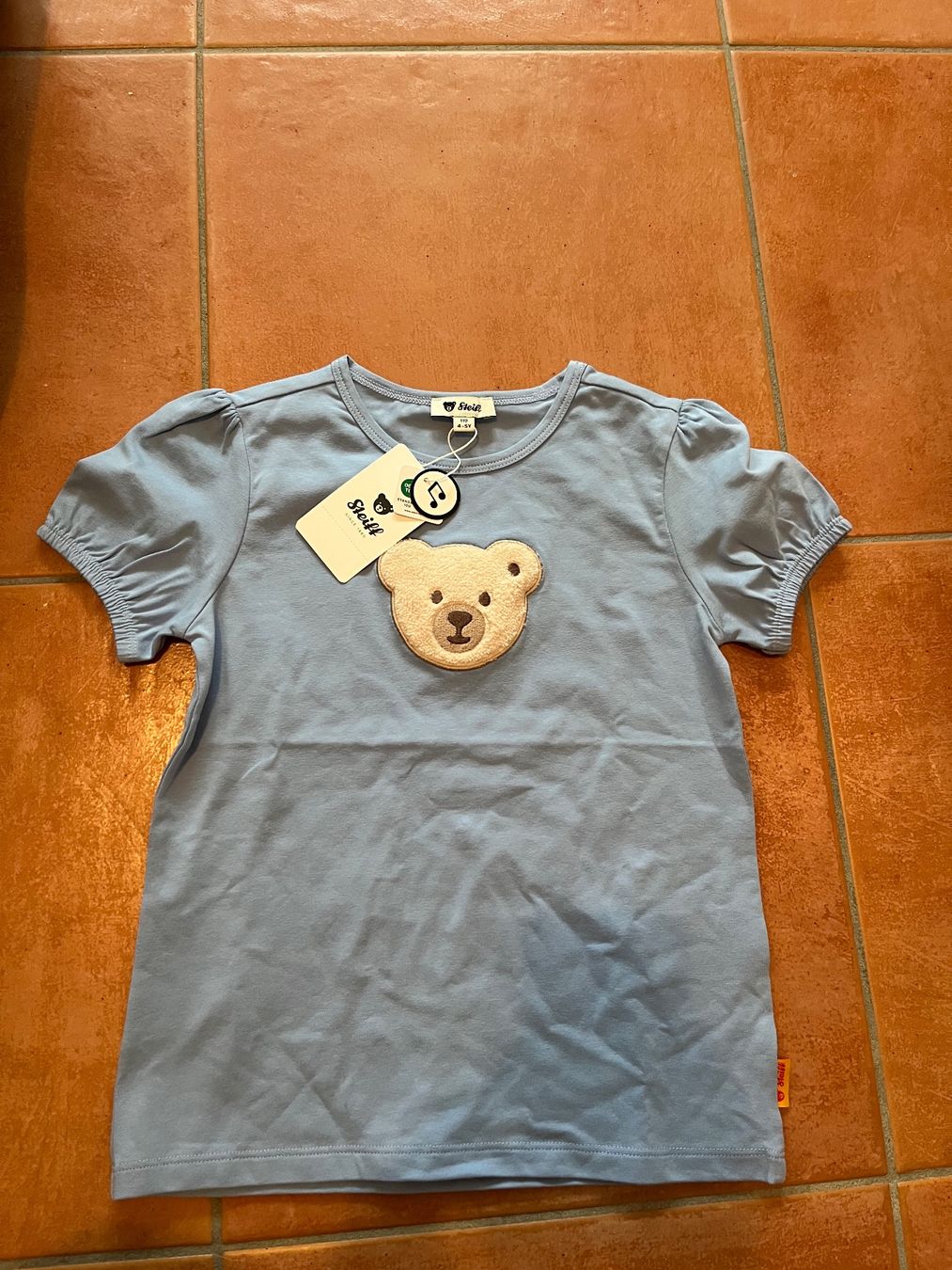 Camicie, T-shirt & Polo: Steiff NEU T-Shirt quietsche Bär 110 – Nuovo e nell'imballaggio originale da Zürich venduto da Gabi_78