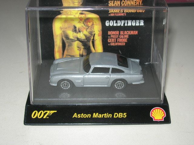 Aston Martin Modellini d'auto: Aston Martin DB5 Bond  * TIC TOC ca. 1:64, – Nuovo e nell'imballaggio originale da Hornussen venduto da Amw 2