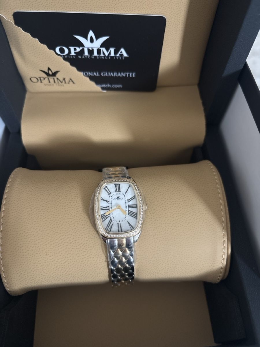 Swiss Montres: Montre OPTIMA – Neuf avec emballage d'origine à La Chaux-de-Fonds par Titine.