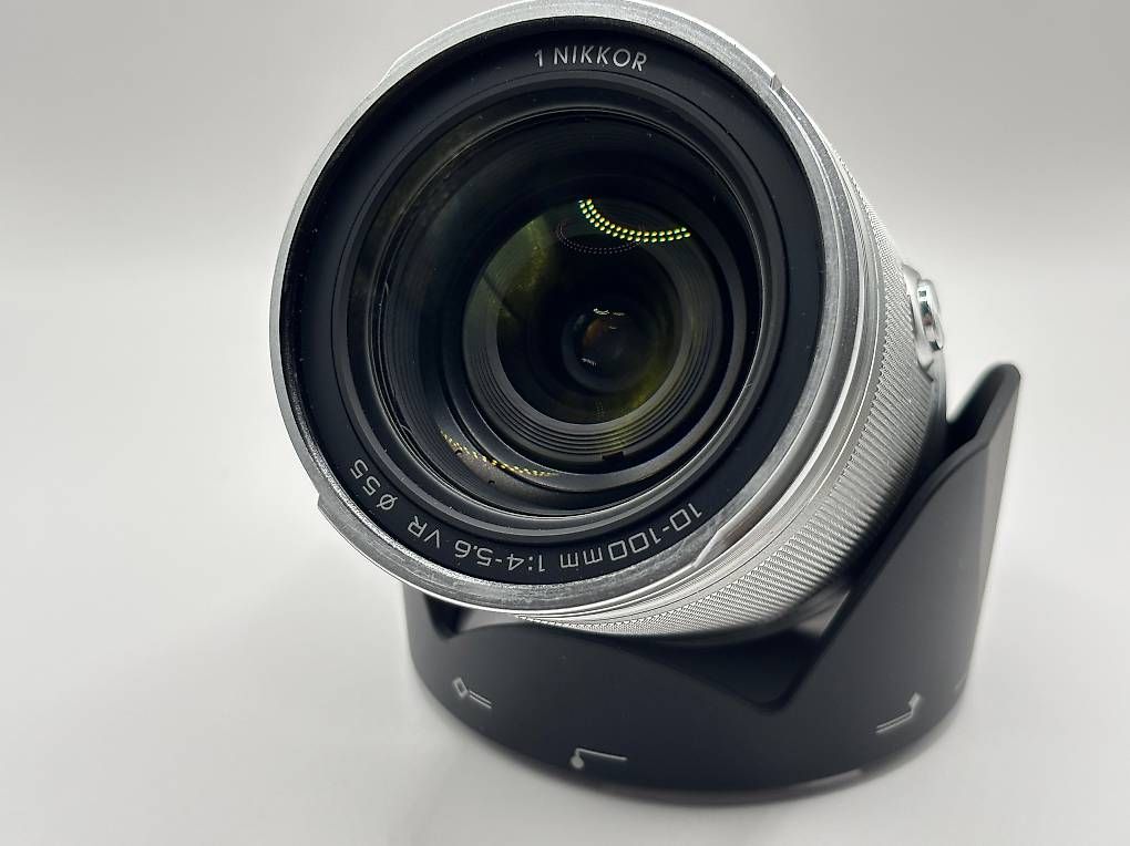 Nikon Obiettivi: Nikon 1 NIKKOR 10-100mm VR Silber – Usato da Merenschwand venduto da Sbj 3