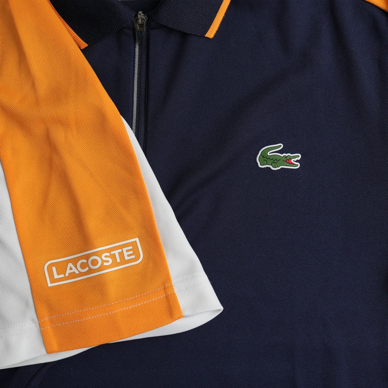 Lacoste Magliette Polo: Lacoste Sport Zip Polo | Navy & Orange – Usato da Zürich venduto da avenlim 2
