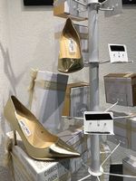 Jimmy Choo gold pumps