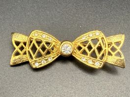 Vintage-Brosche in Form einer goldenen Schleife mit Strass