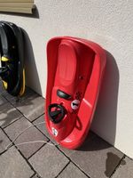 Lenkschlitten rot mit Lenkrad und Zugseil guter Zustand