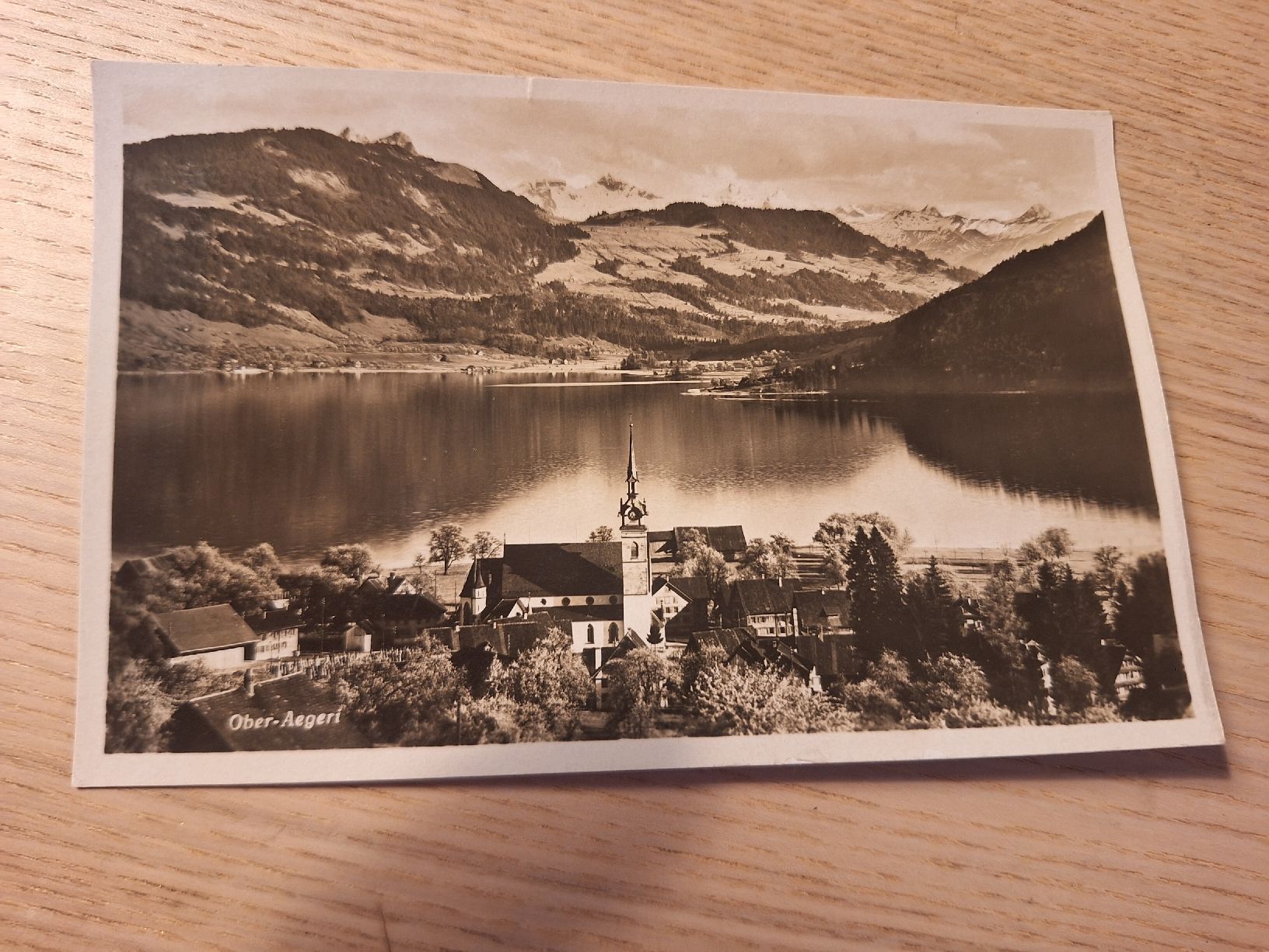 Cartoline postali: Ansichtskarte Ober-Aegeri mit Kirche und See  – Usato da Schaffhausen venduto da RicardoSchaffhausen