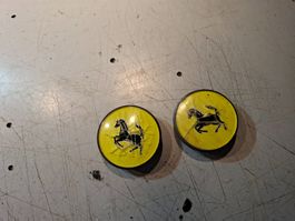 2 Ferrari Radnabendeckel gelb gebraucht mit Rissen