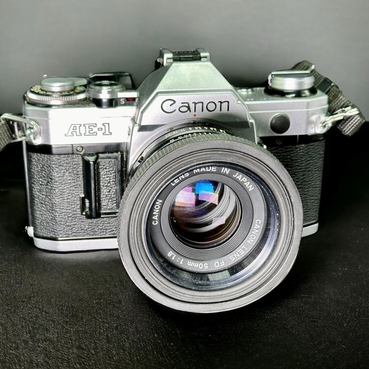 Appareil Photo Argentique Canon AE-1 Program Noir Et Argent + 50 Mm F1 4 Fdn Reconditionne