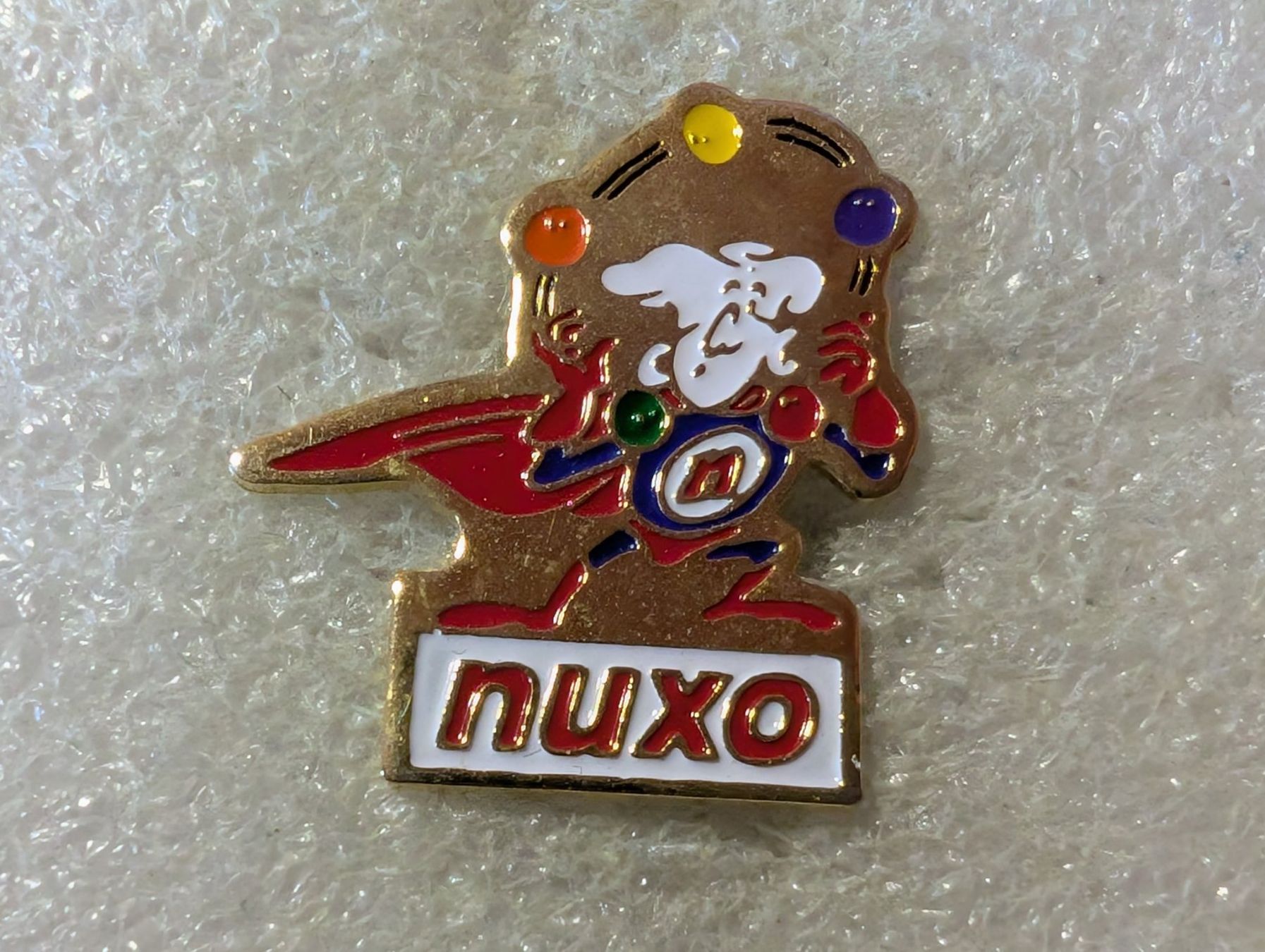 Placchette & Badge: Ansteckpin 172: nuxo – Usato da Oppligen venduto da Pin-Fall-Shop