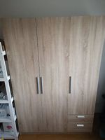Armoire 3 portes, 2 tiroirs + penderie  bois clair