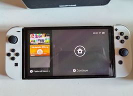 Nintendo Switch OLED avec accessoires et 5 jeux, occ.